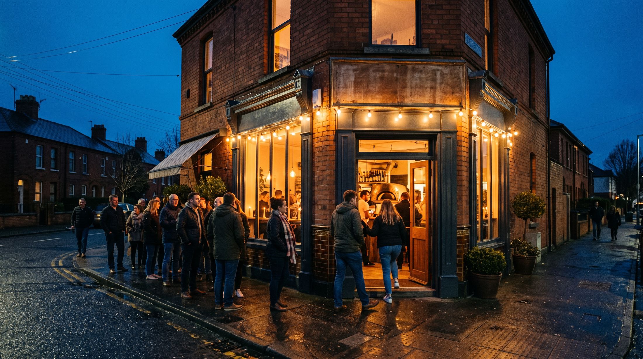 Guests queuing outside a new pizzabar on opening night